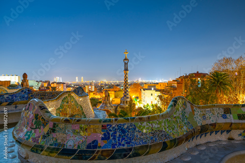 Barcelona at night seen from Park Guell. Park was built from 1900 to 1914 and was officially opened as a public park in 1926. In 1984, UNESCO declared the park a World Heritage Site