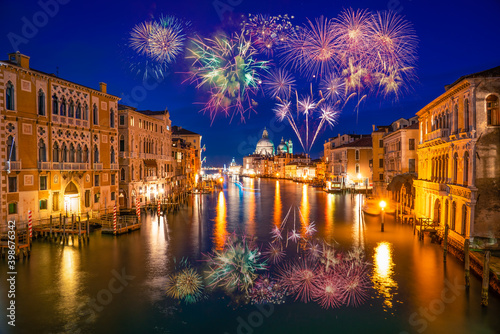 Grand canal and Basilica Santa Maria della Salute with fireworks in Venice, Italy
