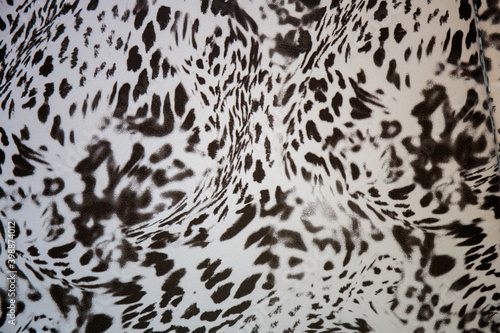 Black and white abstract camouflage. The concealment pattern on a fabric. Conception of winter masking.
