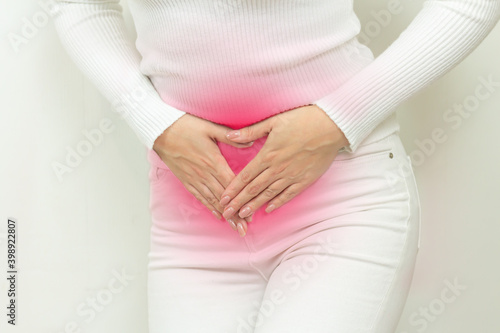 Abdominal pain of young woman, gynecological or medical problems concept