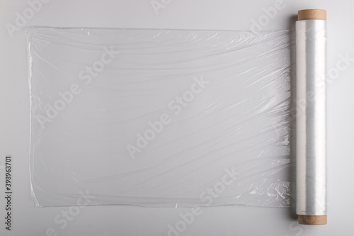 Roll with cling film on white background