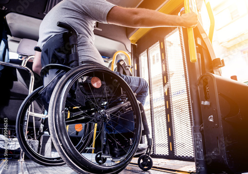 A man in a wheelchair inside of a specialized vehicle 