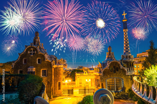 Beautiful fireworks show in Barcelona seen from Park Guell. Park was built from 1900 to 1914 and was officially opened as a public park in 1926. In 1984, UNESCO declared the park a World Heritage Site