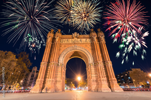 Arc de Triomf at night with fireworks in the city of Barcelona in Catalonia, Spain