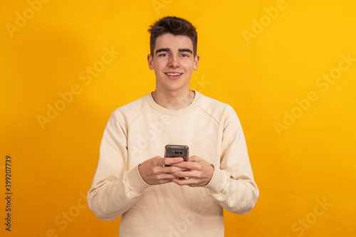 teenager with mobile phone or smartphone isolated on background