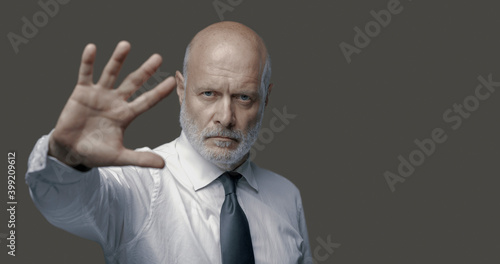 Business executive making a stop gesture