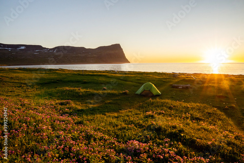 Hloduvík beach campsite at the Arctic ocean, midnight sun during polar day, Hornstrandir nature reserve, Westfjords, Iceland