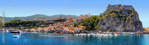 The southern coast of Scilla, Calabria, Italy, in midsummer, overlooking the bathing establishments and the old Ruffo Castle