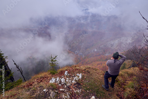 Professional nature photographer in the mountains