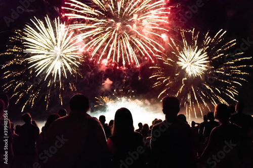 Crowd watching fireworks and celebrating new year eve