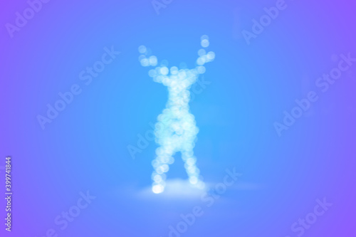 Сhristmas card. Silhouette of a glowing deer on a purple-blue background.