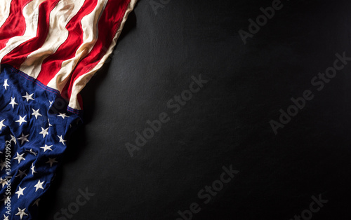 Martin Luther King Day anniversary concept. American flag against black wooden background