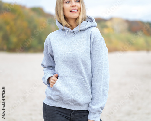Woman wear hoodie on the beach