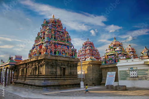 Chennai, India - October 27, 2018: Interior of Arulmigu Kapaleeswarar Temple an ancient Hindu architecture temple located in South India. A little Indian girl running inside a hindu temple