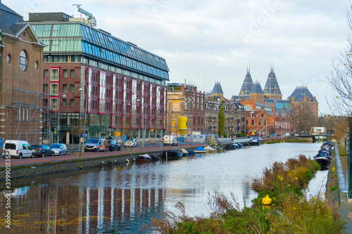 Landscape of Amsterdam with Montessori Lyceum Amsterdam by the canal in Amsterdam, Netherlands