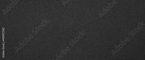 Synthetic black nylon fabric.Texture of dense black fabric.The background is nylon black.