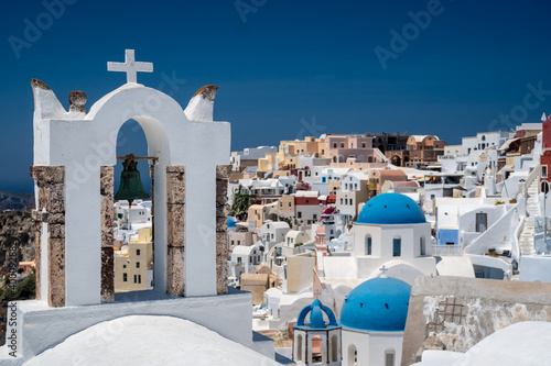 Architecture and landscape of the Santorini island., famous luxury travel vacation getaway. Oia white village with Blue Domes and mills. Amazing warm sunny day