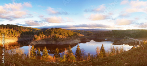 Golden hour landscape panorama of the Okertalsperre, Oker Dam. Reservoir in the forest of the Harz mountains in Lower Saxony, Germany.