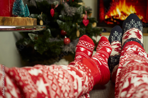 Couple watching a fireplace at christmas
