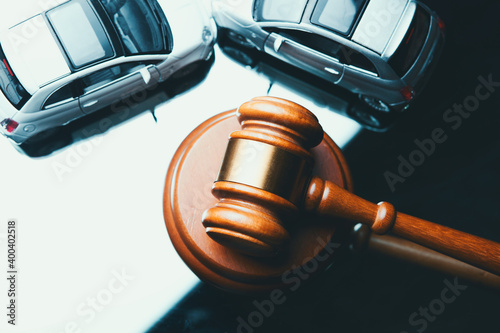 Model of car and gavel. Accident lawsuit or insurance, court case.