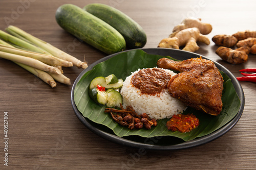 Nasi Kukus is usually comprising freshly steamed rice and crispy fried chicken