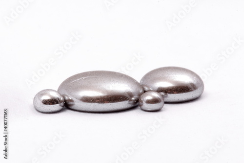 mercury mineral with white background. liquid grey mineral of mercury