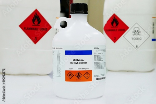Bottle of Methanol, methyl alcohol, MeOH with Properties information and Variety type of chemical containers with its chemical hazard warning symbols. Flammable warning symbol, Toxic warning symbol.