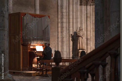 A man plays the organ in a church