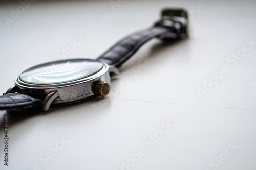  Old wrist watch on a white background.