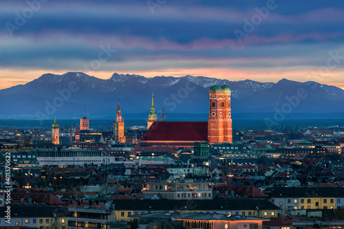 Munich at dusk - Mountains of German Alps behind Frauenkirche
