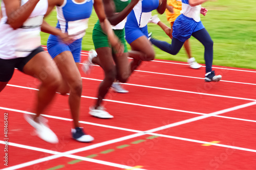 Motion blurred image of women in a track and field sprint event