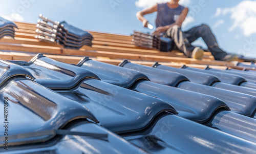 production of roofs from ceramic fired tiles on a family house