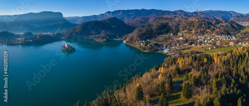 Aerial panoramic view of Lake Bled with island and mountain Triglav in the background, Slovenia