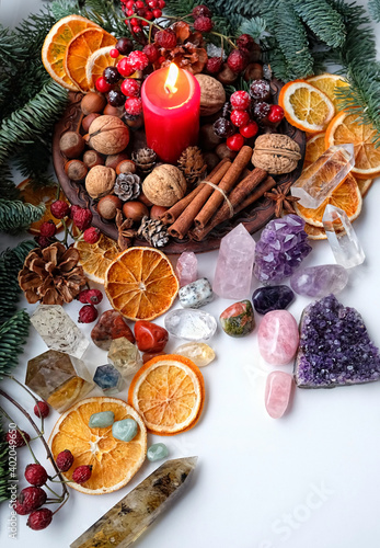 gemstones Crystals set, candle and winter natural decor. Witchcraft Ritual, energy healing minerals. Esoteric, relax, life balance concept. Christmas, Magical Winter Solstice