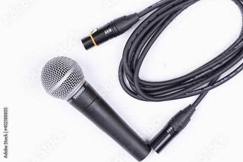 Belgrade, Serbia 18.12.2020. - Shure Microphone with audio cable isolated above white background