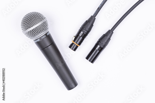 Belgrade, Serbia 18.12.2020. - Shure Microphone with audio cable isolated above white background