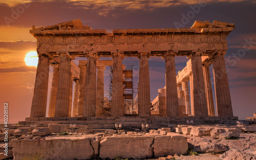 Parthenon temple east front illuminated by dramatic, fiery sunny sky, Athens Greece
