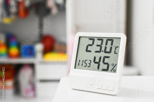 Digital clock, thermometer and hygrometer for nursery or children room. 