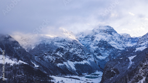 Snowy valley in mountainous terrain