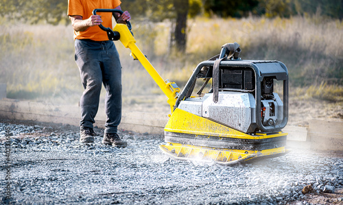 Vibration plate heavy machine compactor for construction compacting or beating sand.