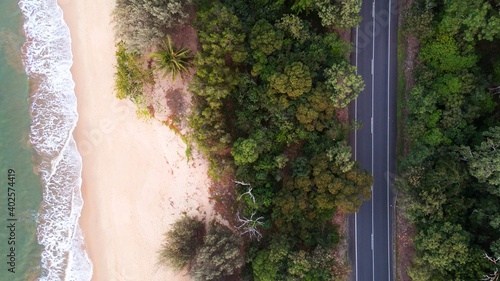 The Captain Cook Highway running right along the tropical North Queensland coast