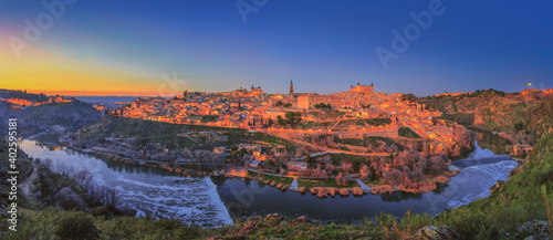 Beautiful winter sunset over Taxo river and the old town of Toledo, Spain