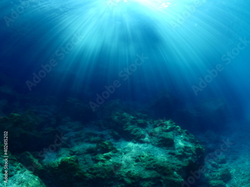 sun ray and sun beam scenery underwater waves on surface of water slow ocean scenery