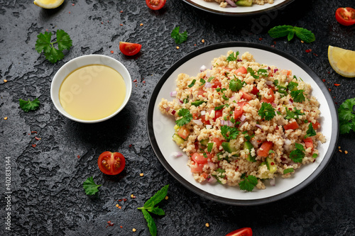 Tabbouleh salad with tomato, cucumber, red onion, bulgur and parsley. Healthy vegan food