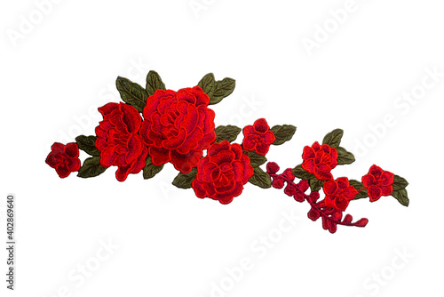 Embroidered composition of red flowers isolated on white background