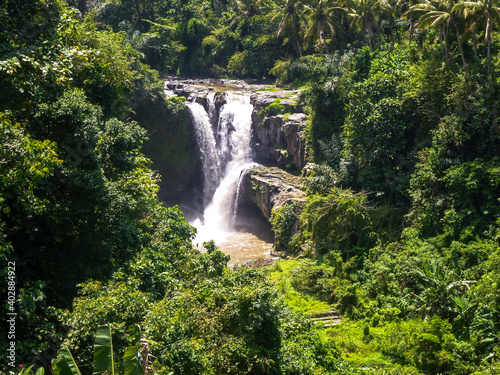 Waterfall on Bali, Indonesia in Asia, the beautiful Tukad Cepung waterfall in the typical Bali nature. jungle nature and green