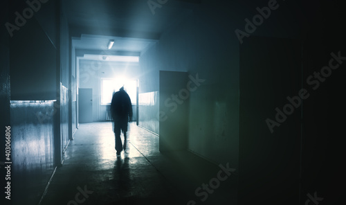 silhouette of a person in a corridor