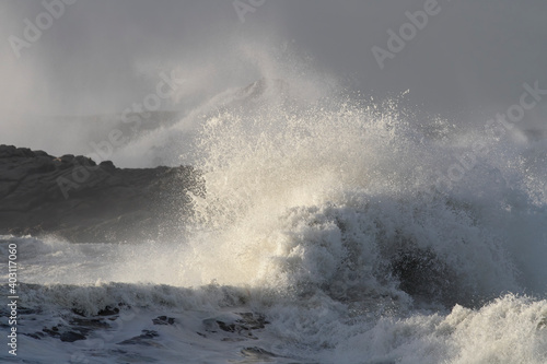 Wave breaking over sea rocks