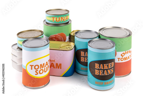 a collection of generic labelled food tins or cans, tomatoes, beans, tuna and soup isolated on white