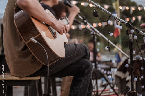 The musician plays and the lead singer sings on stage at the music festival..Concert,mini concert and music festivals.